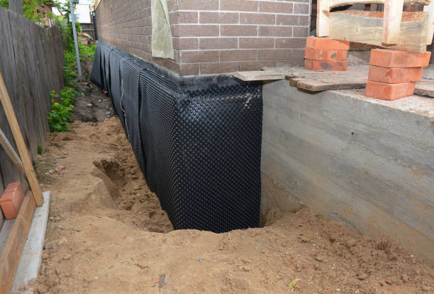 SJ Waterproofing Pros technician performing targeted Waterproofing assessment in Avoca, IN